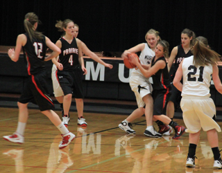 Callie Mader wrestles with a Deary player for the ball as from left MaKayla Schaeffer, Tanna Schlader and Shelby VonBargen watch.