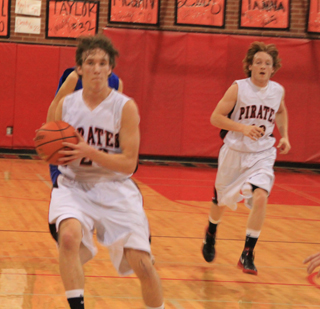 Justin Schmidt comes to a stop and looks to pass as Troy Lorentz trails on the play in the Genesee game.