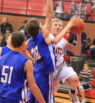 Marcus Higgins drives for a lay-up against Genesee.