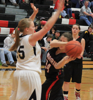 Shelby VonBargen tries to pass around a Deary defender as Megan Sigler looks on.
