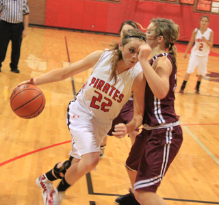 It was tough getting to the hoop against Kamiah as MeShel Rad discovered. In the background is Callie Mader.