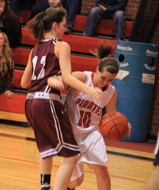 Megan Sigler battles to get past Kamiah's Kyndal Ulmer along the baseline.