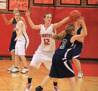 Prairies MaKayla Schaeffer tries to tip the pass made by Summits Nicole Wemhoff. In the background are Savanah Prigge and Tanna Schlader and at right is Nicole Frei.