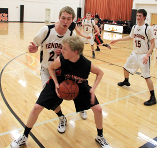 Marcus Higgins looks to make a pass in the Kendrick game.