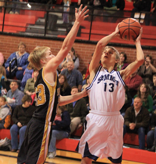 Shane Stubbers puts up a shot for Summit against Timberline.