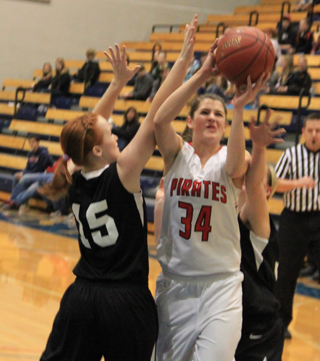 Shelby VonBargen splits a pair of Deary defenders as she goes to the hoop.
