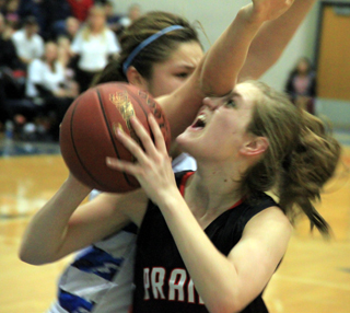 It got a little rough underneath as Tanna Schlader gets an eye full of elbow as she goes up for a shot.