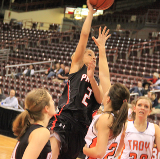 Callie Mader puts up a shot against Troy. At left is Tanna Schlader.