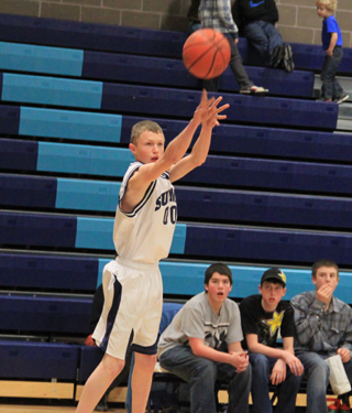 Dan Wemhoff shoots a 3-pointer against Highland in the District opener.