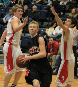 Marcus Higgins went right between 2 defenders for a lay-up in the C.V. game at District.