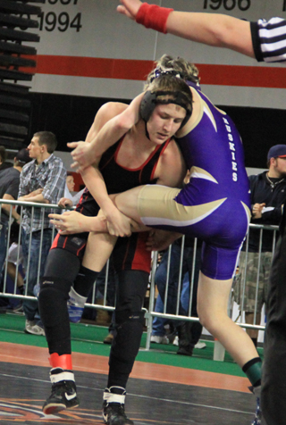 Alex Duman tries to get leverage against Shad Cordingley of North Fremont in the consolation quarterfinals.