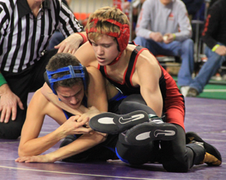 Dally Ratcliff gets a cradle on Jace Wilding of Firth in his opening round match.