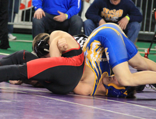 Hunter McWilliams has Colton Rose of Raft River in a painful looking position as he was about to score a pin.