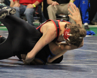 Tyler Ross' only win at state this year came against Vladi Garcia of Valley against whom he is shown getting back points.