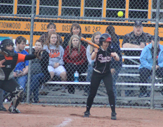 Monica Lustig was able to get the bat on this high pitch and lay down a successful sacrifice bunt.