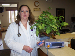 Faunda Butler, SMH Respiratory Therapist showing off their new pulse oximeter.