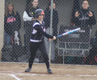 Kelsey Tidwell singles up the middle to knock in the Taylor Nuxoll from third with the go-ahead run against Highland.
