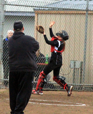 MeShel Rad gets ready to catch a pop up behind home plate in the game against Highland.