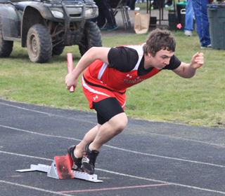 Dakota Wilson gets out of the blocks at the start of the boys 4x200 relay.