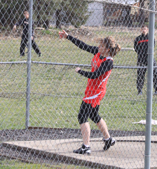 Heidi Holubetz lets fly with the discus at the Kamiah Invitational.