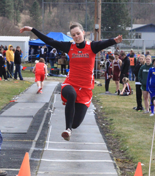 MaKayla Schaeffer flies towards the pit in the long jump, one of the two events she won last Friday at Kamiah.