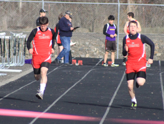 Nathan McElroy and Austin Sonnen run a heat of the 100 at the Lapwai meet.