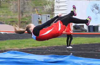 Keely Schmidt clears the bar in the high jump.