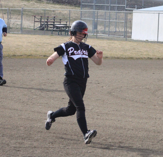Monica Lustig pulls into third with a first inning triple.