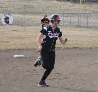 MeShel Rad rounds second on a 2-run first inning homer.