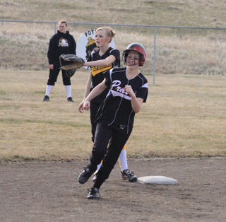 Mckenzie Rieman had a big smile as she rounds second on her way to third with a triple against Timberline.