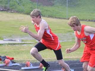 Lucas Arnzen gets out of the blocks at the start of one of the heats of the 100 meter dash.