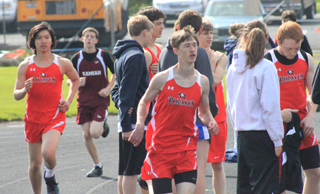 Exchange student Wise Kittithakorn and Dylon Bruegeman in the 3200. At right is Troy Lorentz who was competing in the high jump.