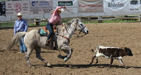 Kelsey Tidwell in breakaway roping at the high school rodeo in Asotin Saturday.