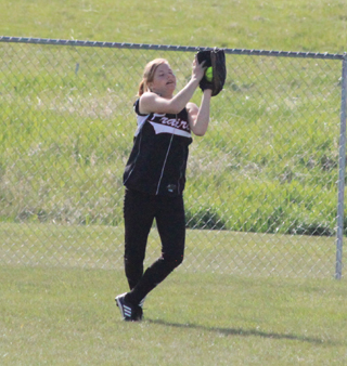 Kelsey Tidwell catches a fly ball to right in the Highland game at Cottonwood.