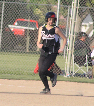 Mckenzie Rieman pulls into second base with a double in the District championship game against Genesee.
