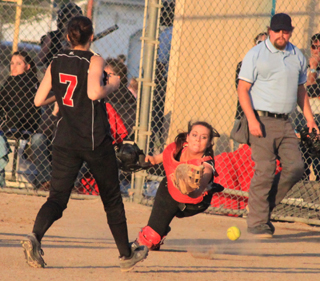 MeShel Rad couldnt quite reach this foul pop-up in the championship game against Genesee as Mckenzie Rieman comes over from third base.
