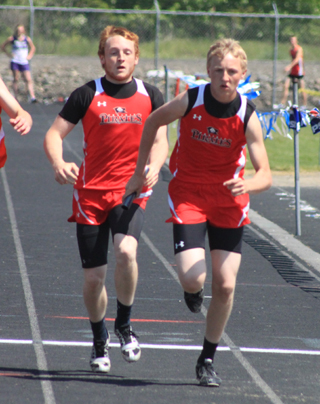 Troy Lorentz hands off to Marcus Higgins in the 4x200. Prairie finished 3rd, 1 spot shy of qualifying for State.