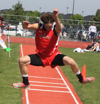 Justin Schmidt set a new personal best of 4111 on this triple jump attempt and earned a 2nd place medal at State.