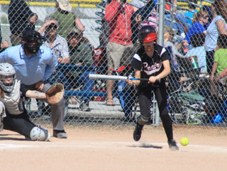 Leah Holthaus has perfected the art of the bunt single over the last several games. Here she drops down one of 3 bunt singles in the Troy game. 4 of her 5 hits in the tournament were bunts.