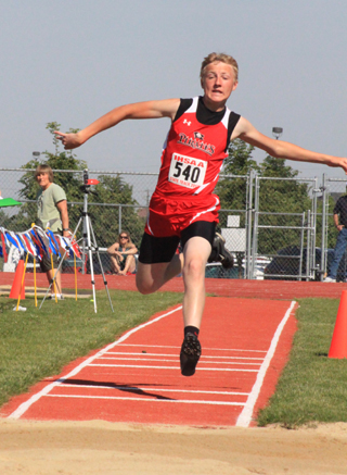 Marcus Higgins in the second stage of the Triple Jump at State.