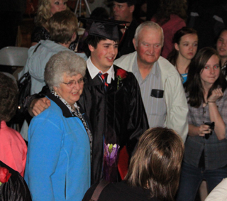 Cody Schumacher gets a photo taken with his grandparents, Ambrose and Margie Schumacher.