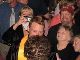 Lori Schmidt gets a picture of the back of Troy Lorentzs head where he had 2012 shaved into his hair. And yes that is a Mohawk haircut on top too.