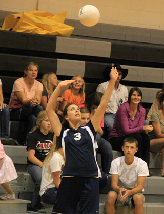 Megan Rehder is about to serve for Summit at the Highland Jamboree.