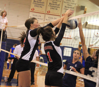 Tyler Workman and Leah Holthaus make a block against Grangeville.
