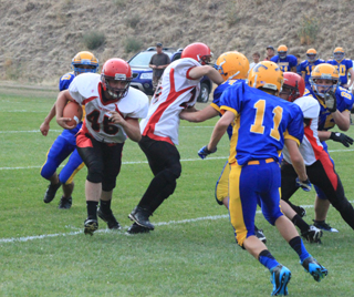 Garrett Schmidt carries the ball at Salmon River.