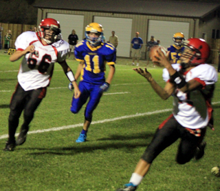 Tyler Hankerson catches a touchdown pass on the final play of the game at Salmon River. At left is Seth Chaffee.