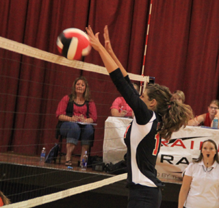 Shelby VonBargen goes for a block in the Troy match.