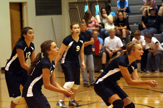 Summit players are ready for serve receive in the match last week at Highland against Nezperce. From left are Megan Seubert, Rachel Waters, Rachael Frei and Sarah Chmelik. Photo by Steve Wherry.