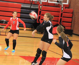 Beka Bruner makes a pass in the Potlatch match as Stephanie Gimmeson, left, and Krystin Uhlenkott look on.