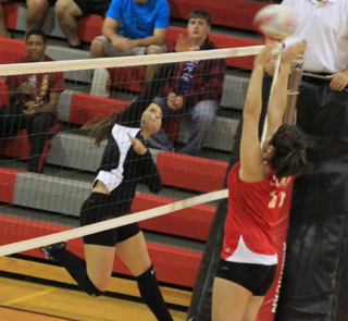 Cheryl Gehring spikes the ball in the C.V. match.